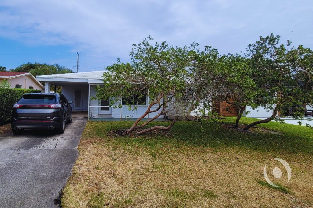 A residential renovation transforming a carport into accessible living space with improved layout, functionality, and buildable design