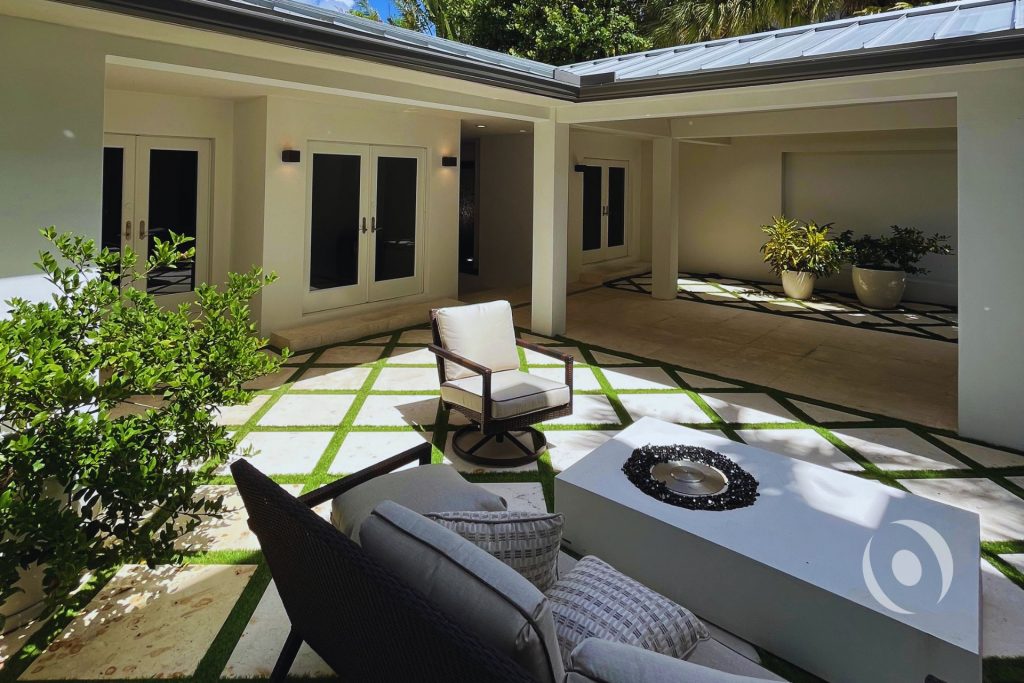 Residential outdoor living space inspected for structural compliance including slab and covered patio framing