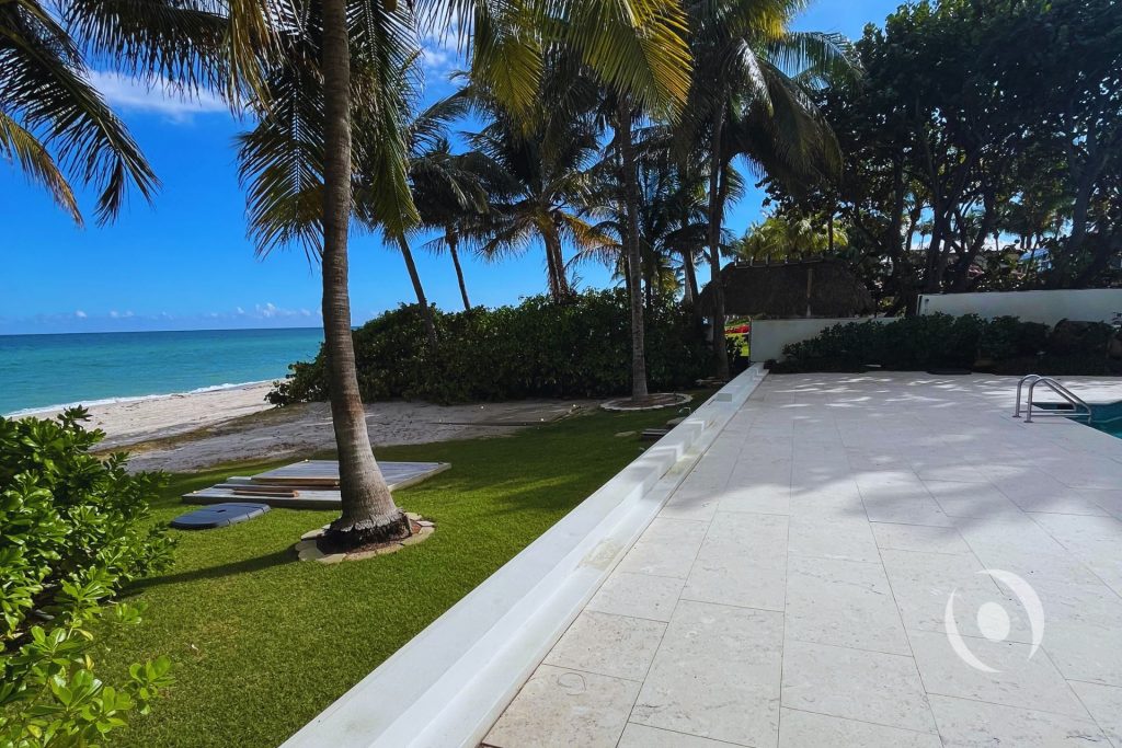 Coastal residential property with pool deck and structural elements inspected for foundation and slab integrity