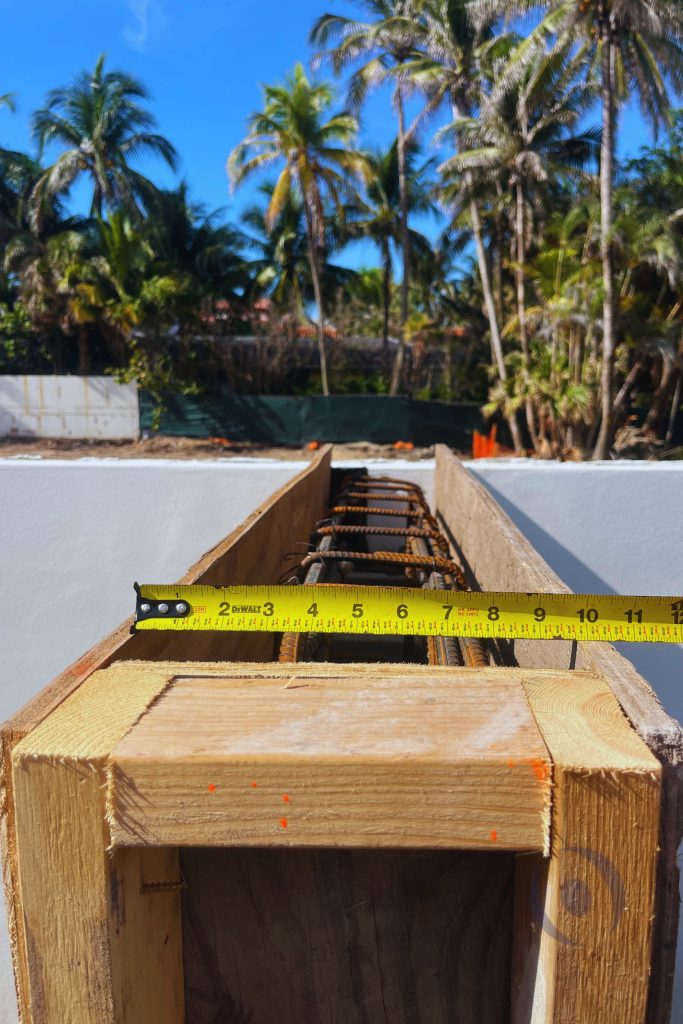 Reinforced concrete beam formwork with rebar spacing measurement during structural inspection process