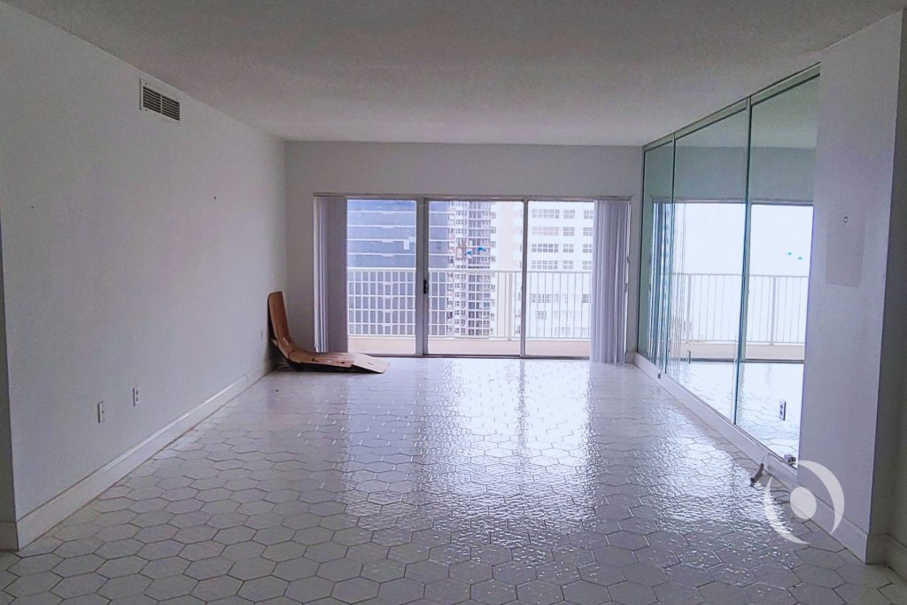 Before photo of oceanfront condominium living room in Hallandale Beach prior to full architectural and MEP engineering renovation by NOHMIS