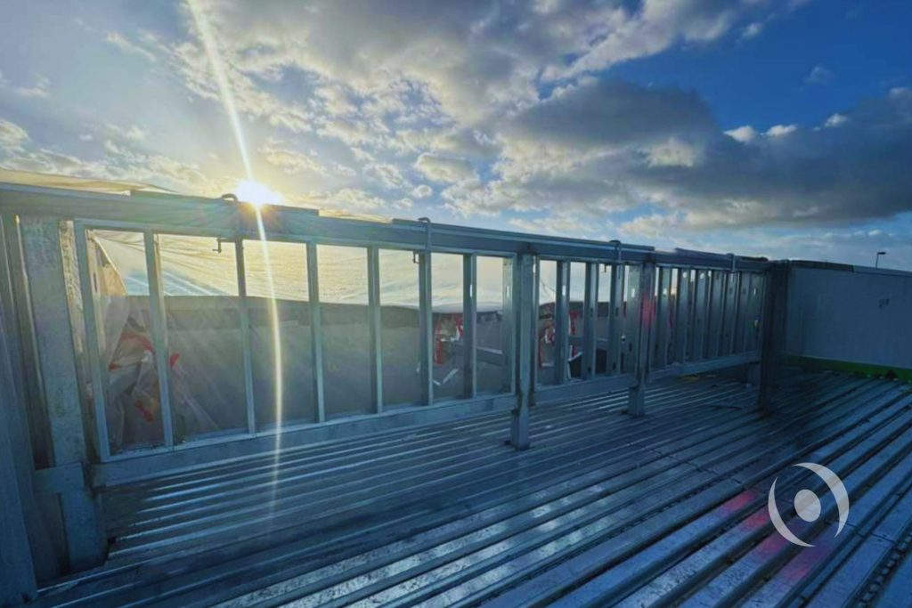 Cold-formed steel screen wall framing under construction on commercial rooftop with metal deck — structural screen wall design by NOHMIS, Coral Springs, FL