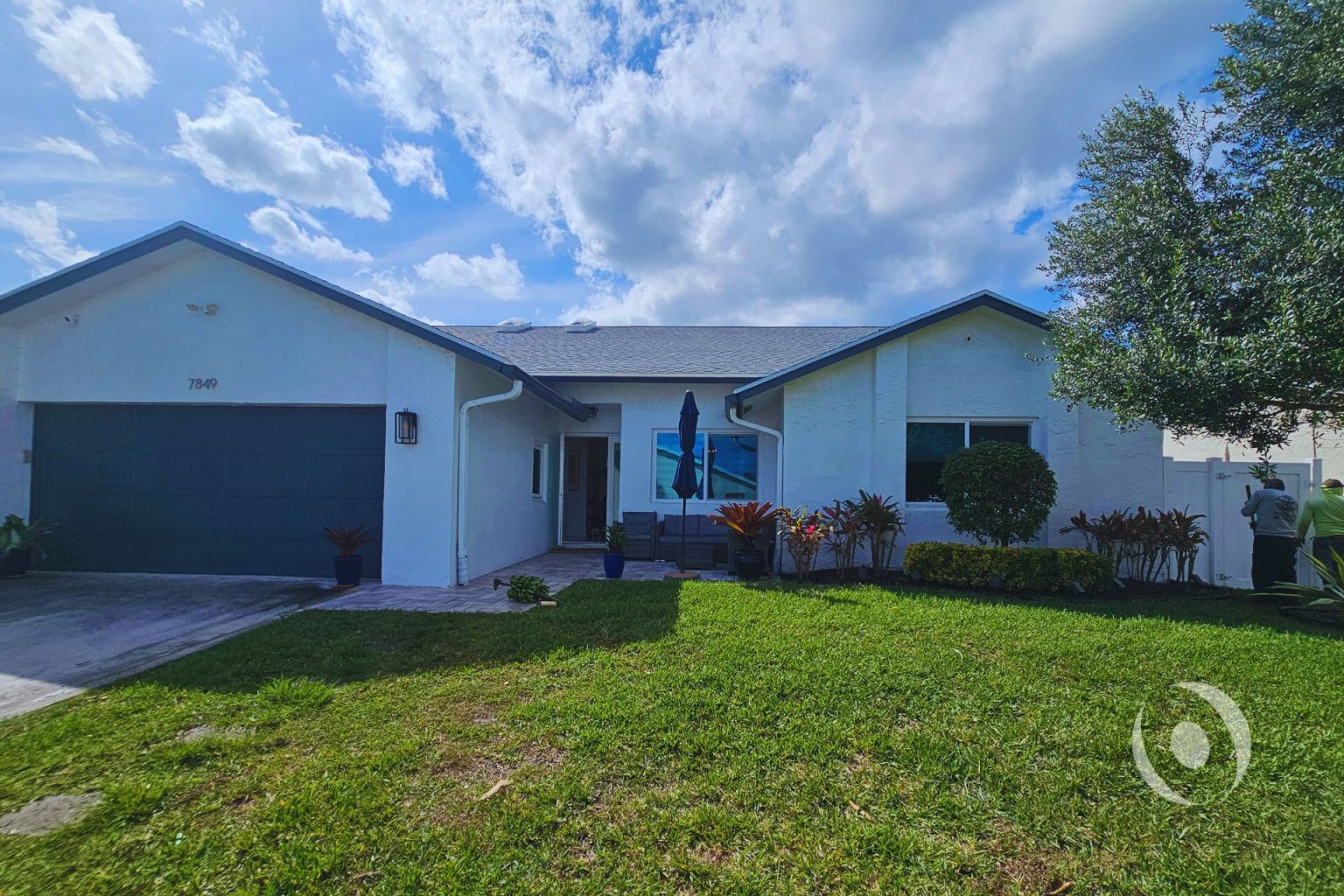 Existing conditions exterior view of a single-family home in Boca Raton, Florida prior to residential addition, garage conversion, and full interior renovation designed and engineered by NOHMIS