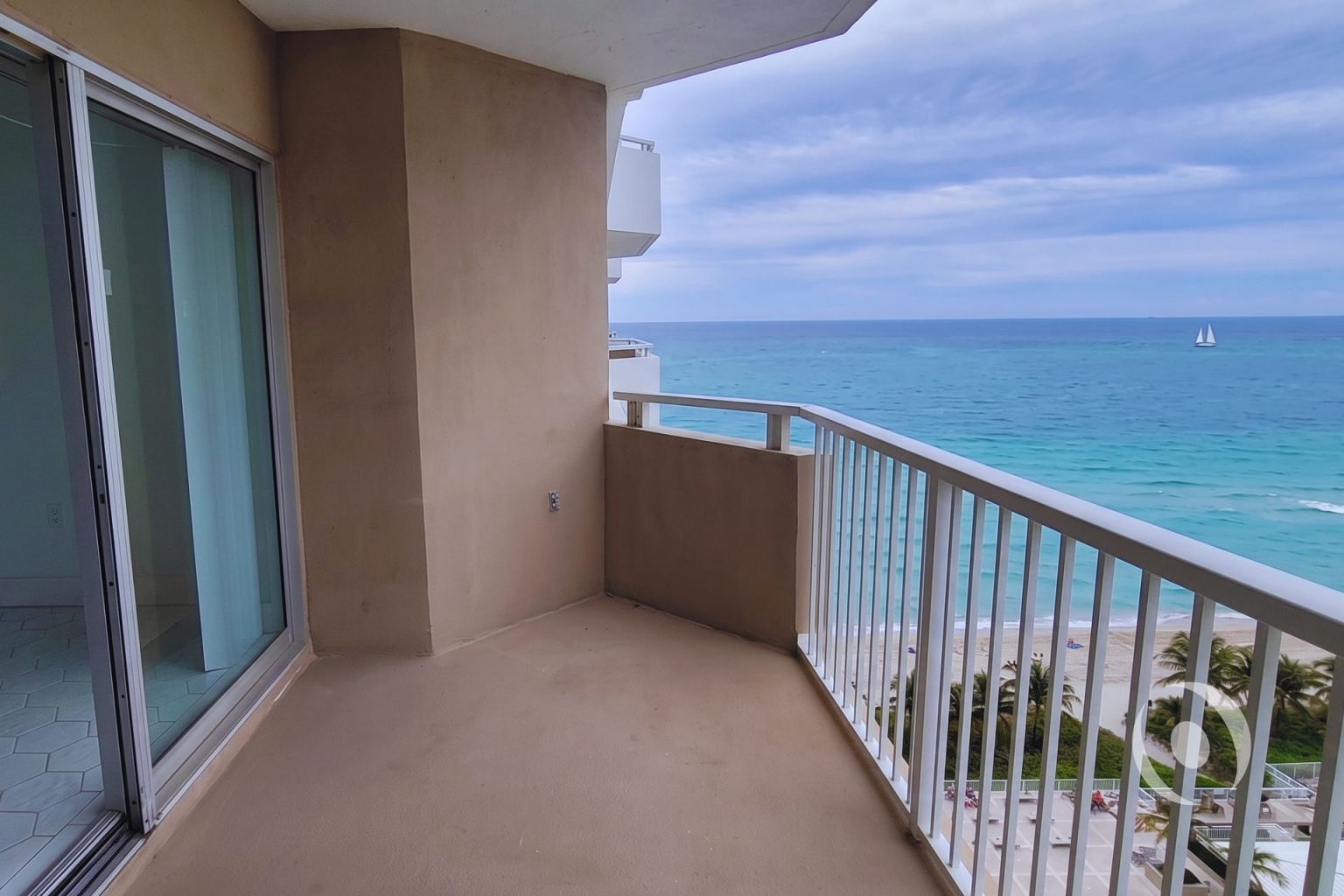 Oceanfront balcony of high-rise condominium before interior renovation in Hallandale Beach Florida showing Atlantic Ocean view