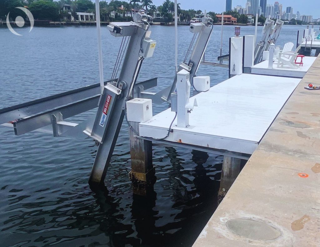 Completed seawall and dock system engineered by NOHMIS in South Florida, showing reinforced concrete seawall and waterfront stability improvements