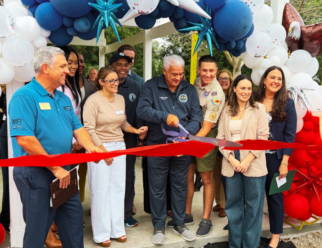 The Eagle Scout project ribbon cutting with Karen Ross, Peyton Ross and the whole childrens community