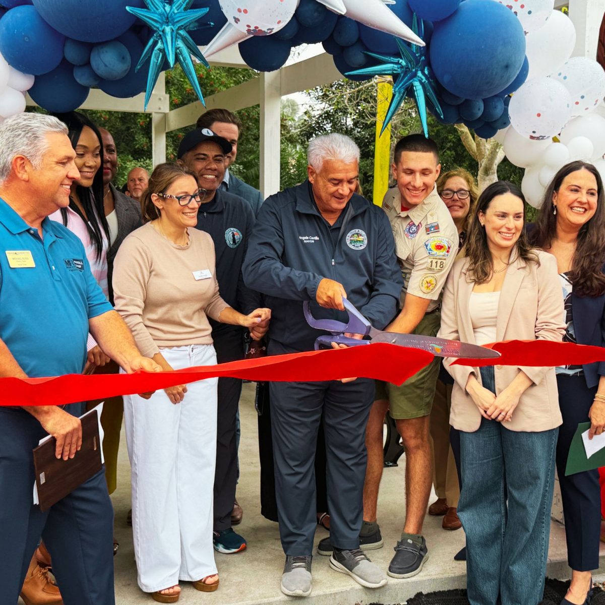 The Eagle Scout project ribbon cutting with Karen Ross, Peyton Ross and the whole childrens community