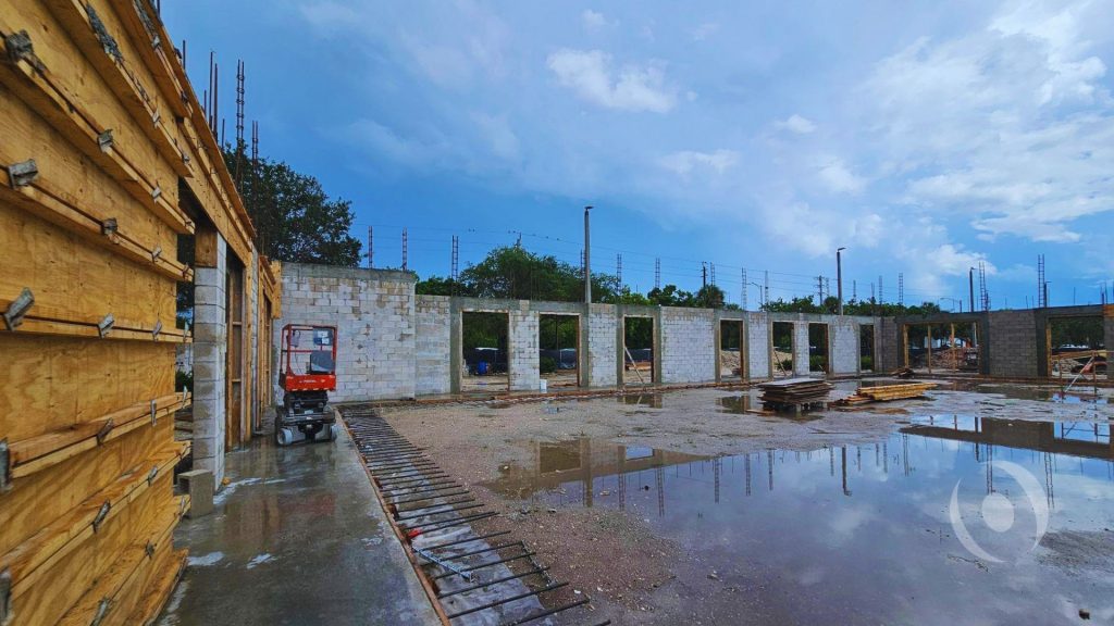 CMU shell walls and structural framing rising during active construction of the new multi-tenant commercial building at Riverstone Shoppes in Parkland, Florida, engineered by NOHMIS 