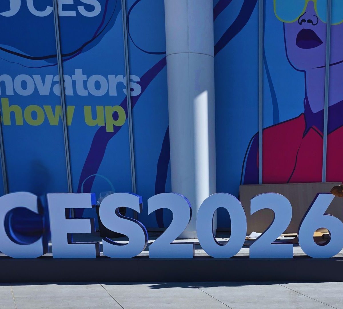NOHMIS CEO Joseph Simhon standing beside the CES 2026 sign in Las Vegas.
