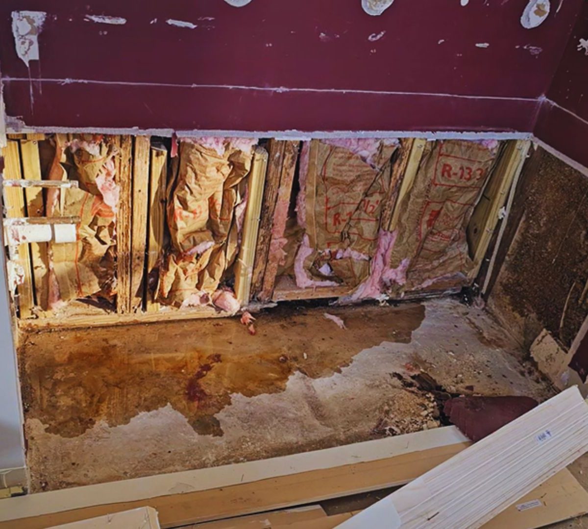 Interior water intrusion damage caused by hydrostatic pressure beneath a concrete slab foundation in South Florida.
